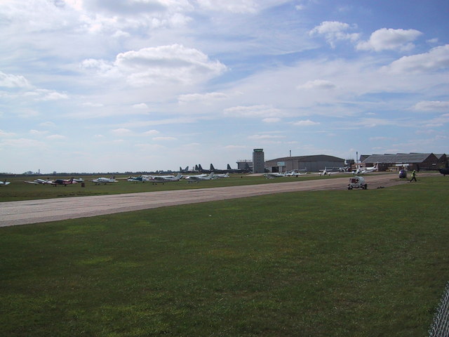 A private jet taking off from Cambridge Airport's runway